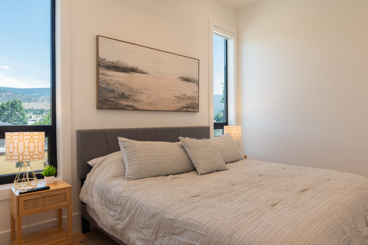 Bedroom with a corner window onto the hills